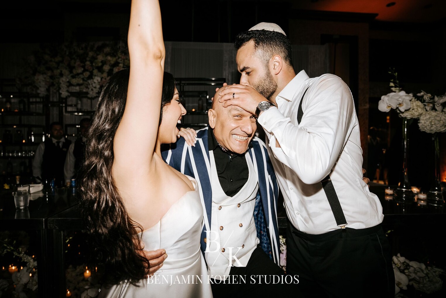 Sandro celebrating with a newlywed couple